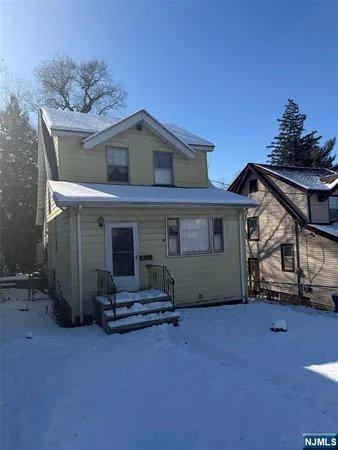 a house with trees in the background