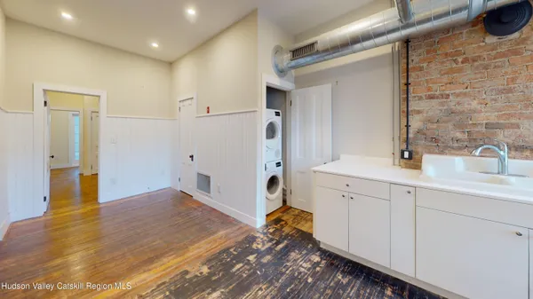 a spacious bathroom with a sink and a mirror