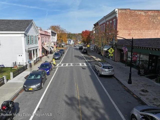 a city street lined with buildings and cars