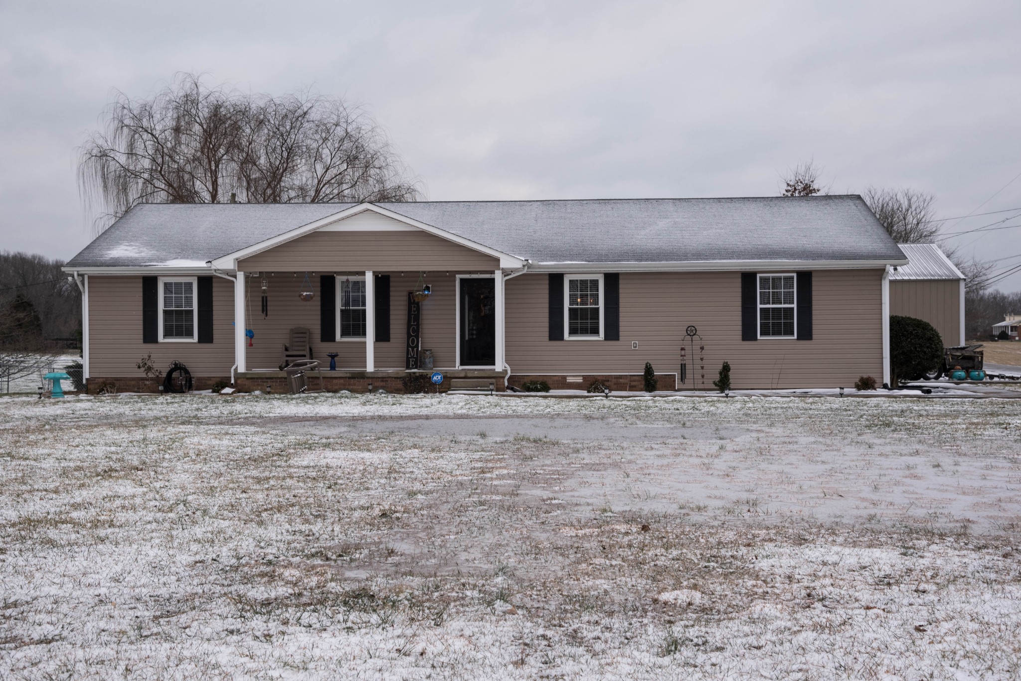 105 Biggs Road Cottontown, TN 37048 - Photo 1 of 40 a front view of a house with garden