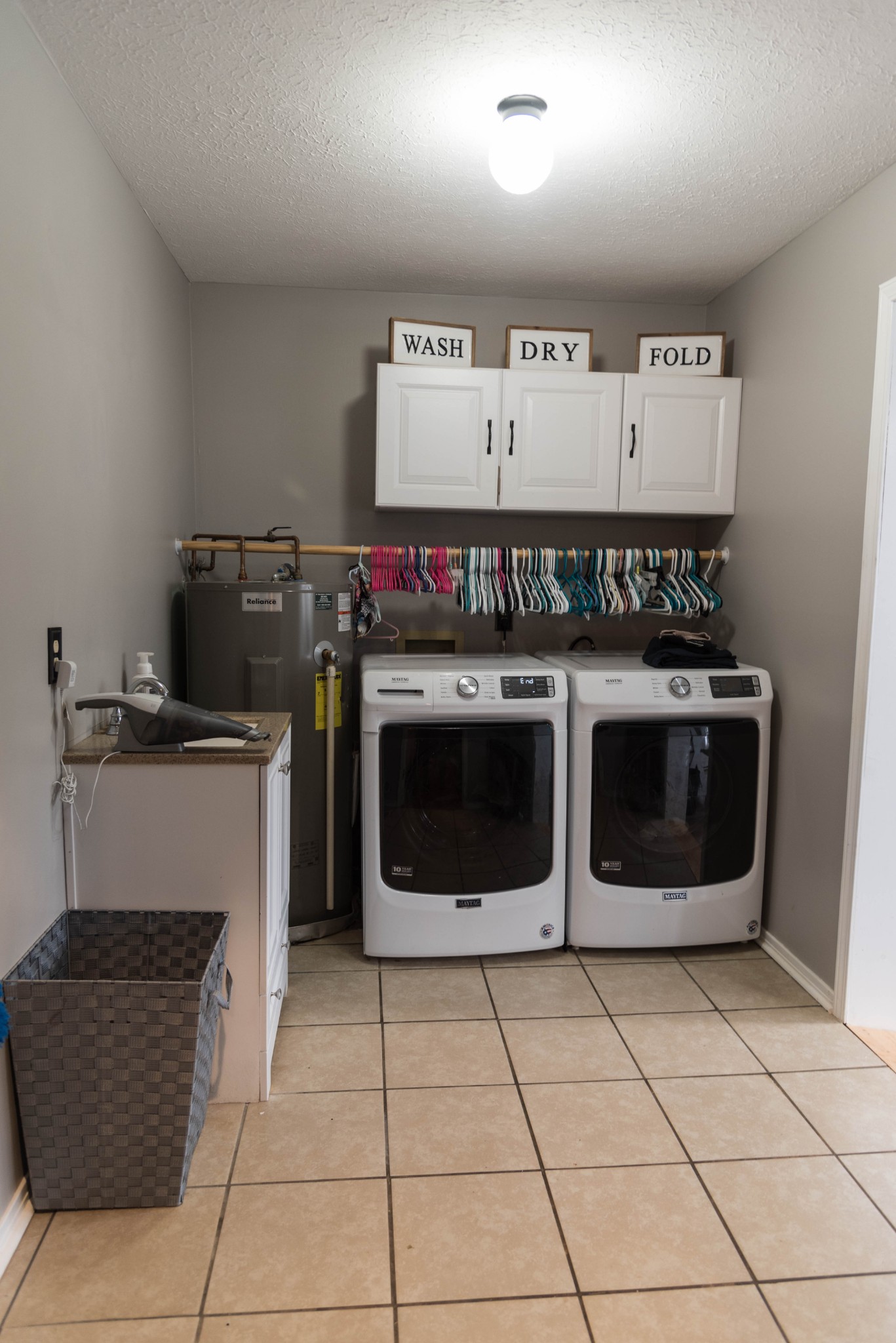 105 Biggs Road Cottontown, TN 37048 - Photo 11 of 40 a kitchen with a stove top oven and cabinets