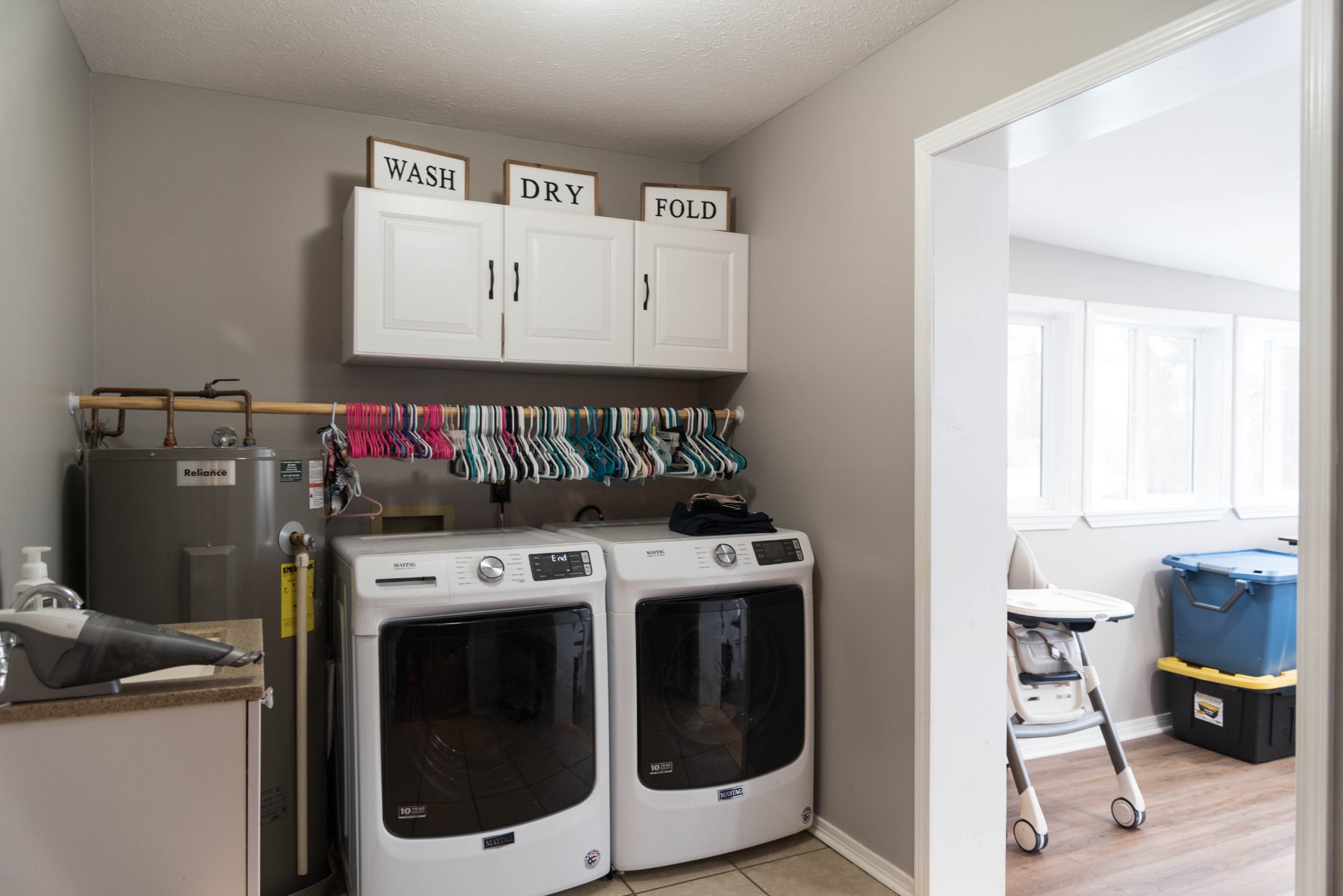 105 Biggs Road Cottontown, TN 37048 - Photo 12 of 40 a utility room with dryer washer and storage