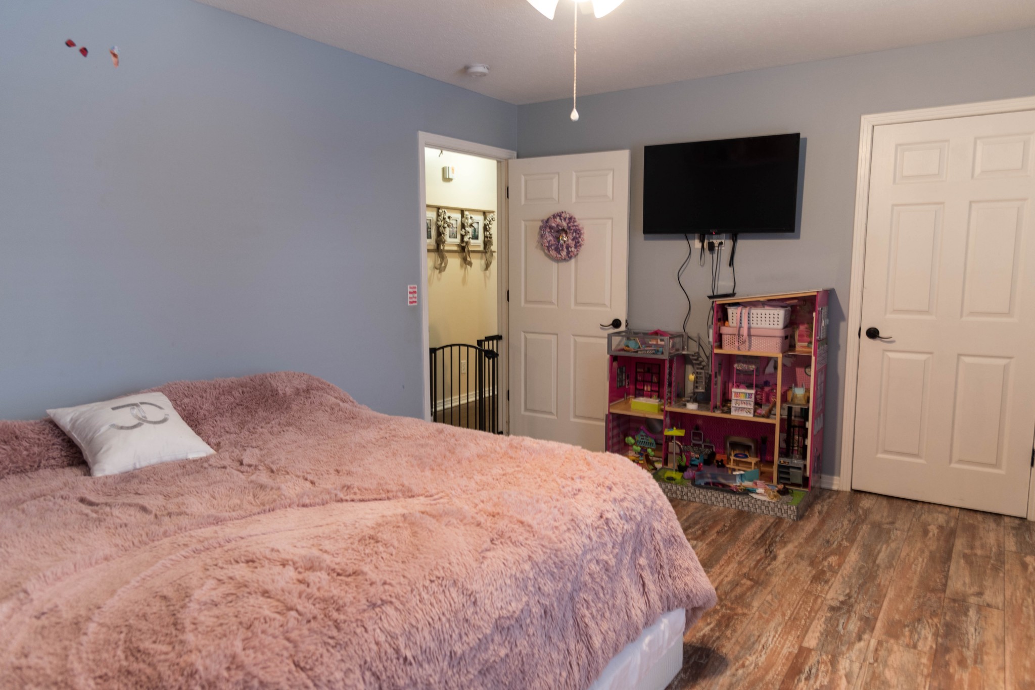 105 Biggs Road Cottontown, TN 37048 - Photo 25 of 40 a bedroom with a bed and a flat screen tv