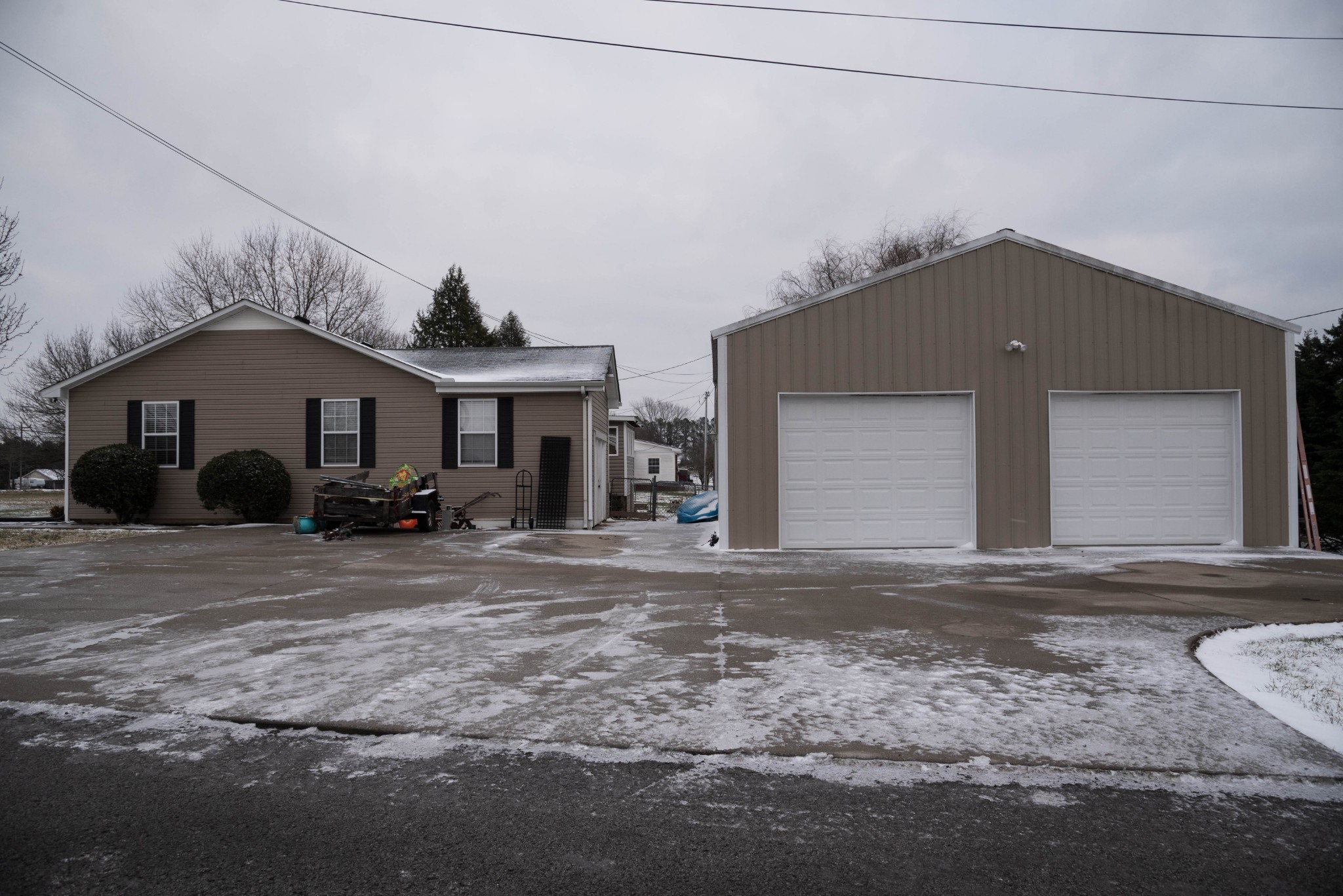 105 Biggs Road Cottontown, TN 37048 - Photo 3 of 40 a front view of a house with a yard and garage