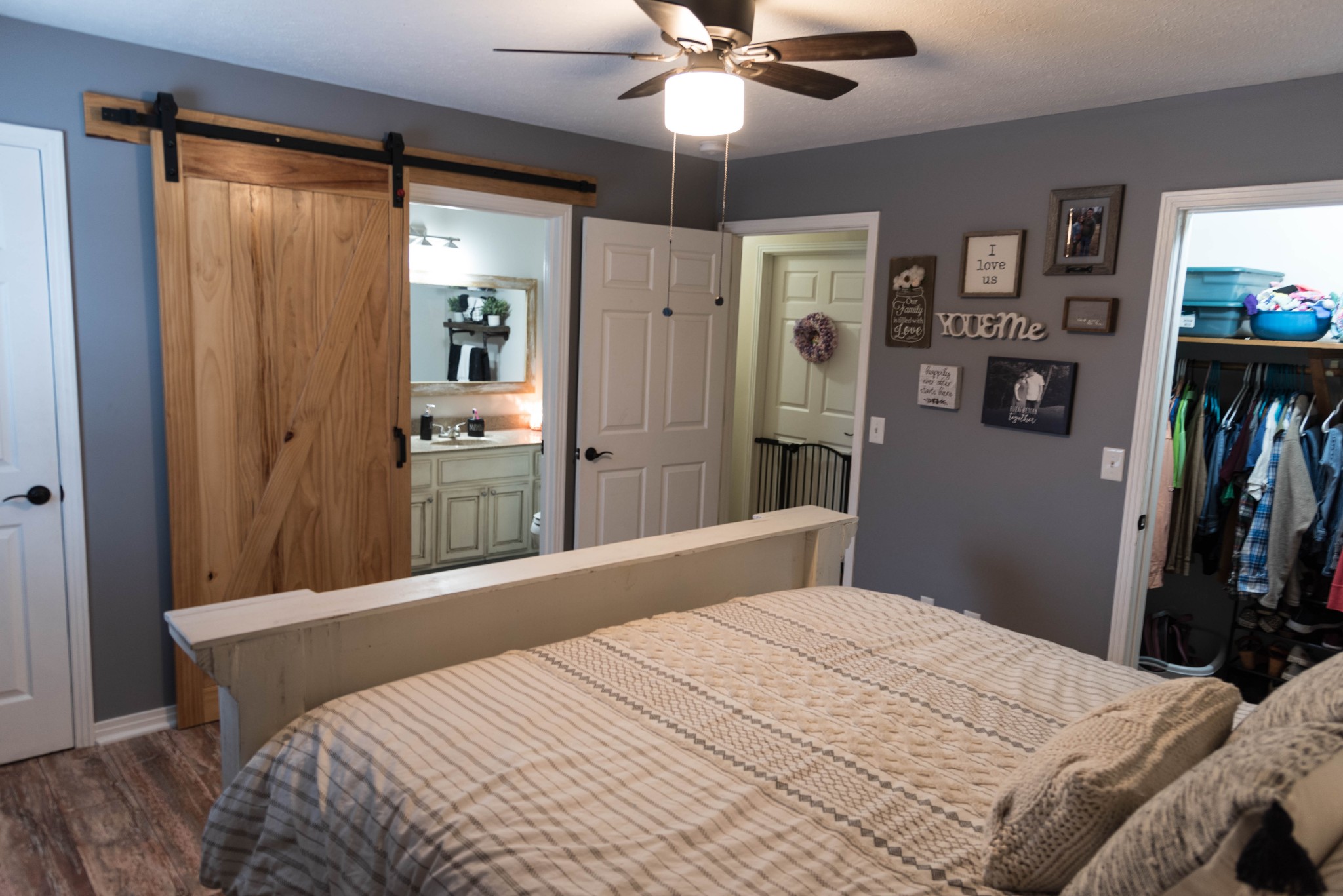 105 Biggs Road Cottontown, TN 37048 - Photo 31 of 40 a bedroom with a bed and a chandelier