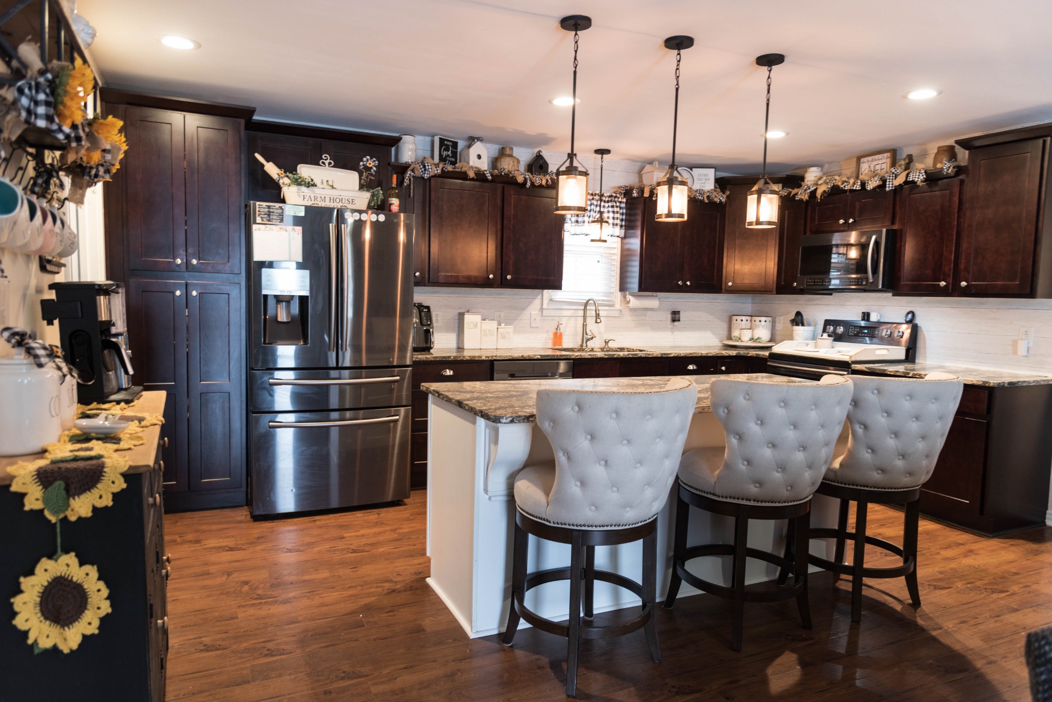 105 Biggs Road Cottontown, TN 37048 - Photo 7 of 40 a kitchen with granite countertop a sink cabinets and stainless steel appliances