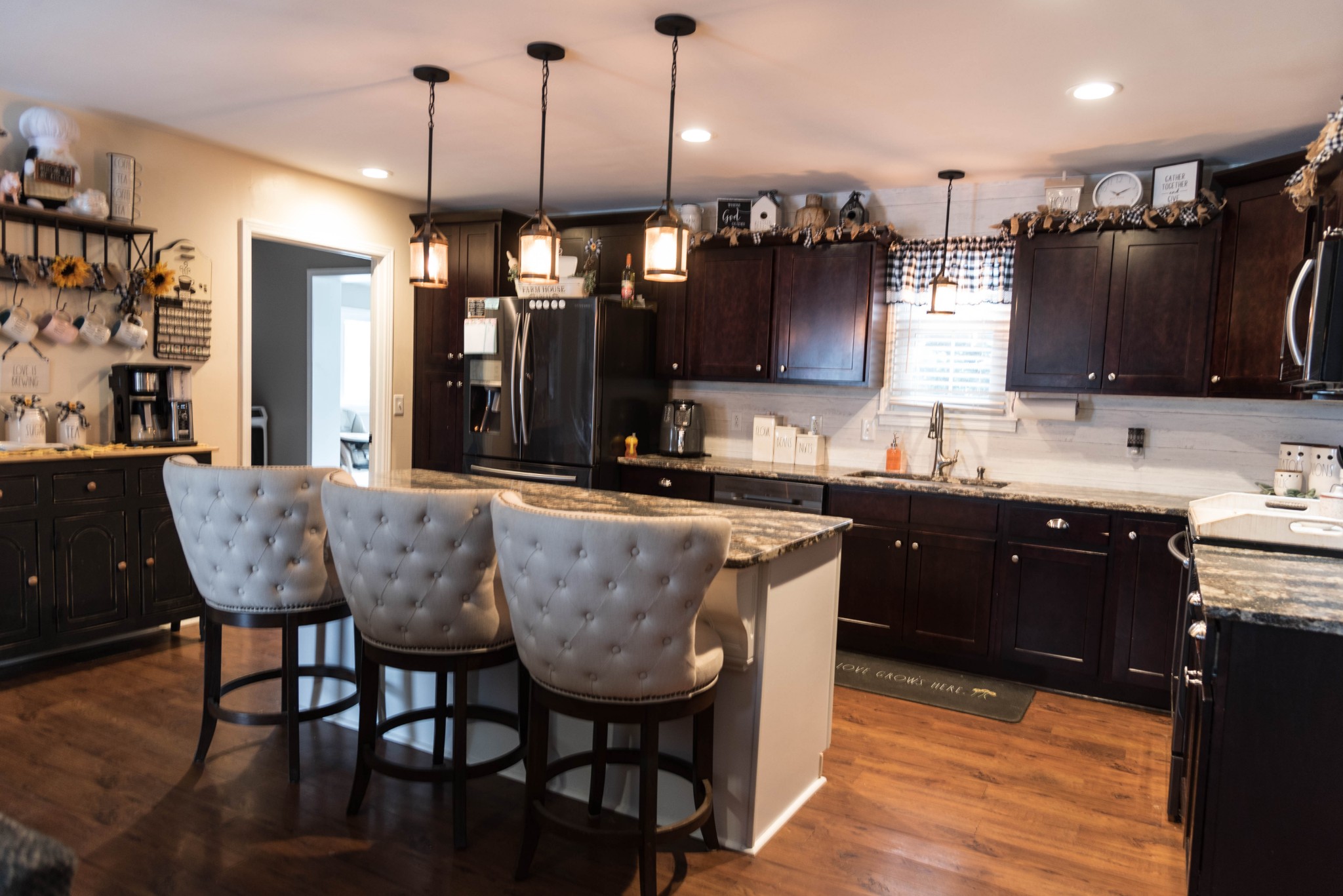 105 Biggs Road Cottontown, TN 37048 - Photo 8 of 40 a kitchen with granite countertop a sink dining table and chairs