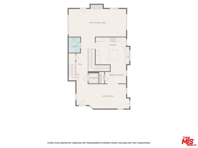 a utility room with a sink and mirror