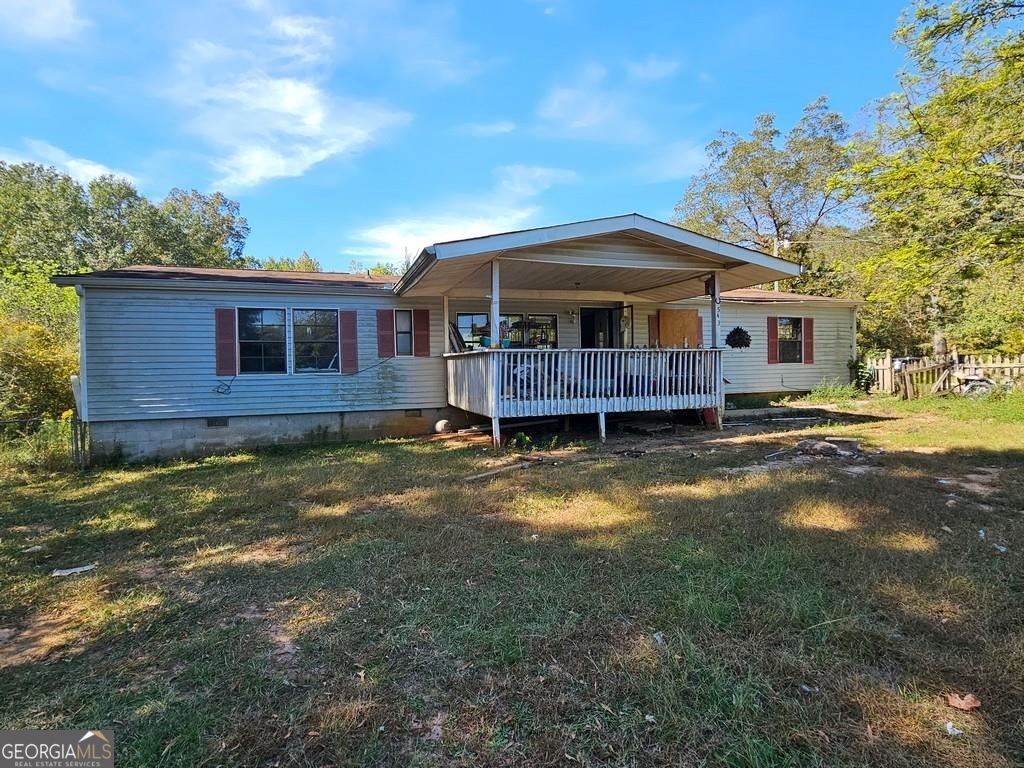 543 Flat Rock Road Stockbridge, GA 30281 - Photo 1 of 1 a view of a house with a yard