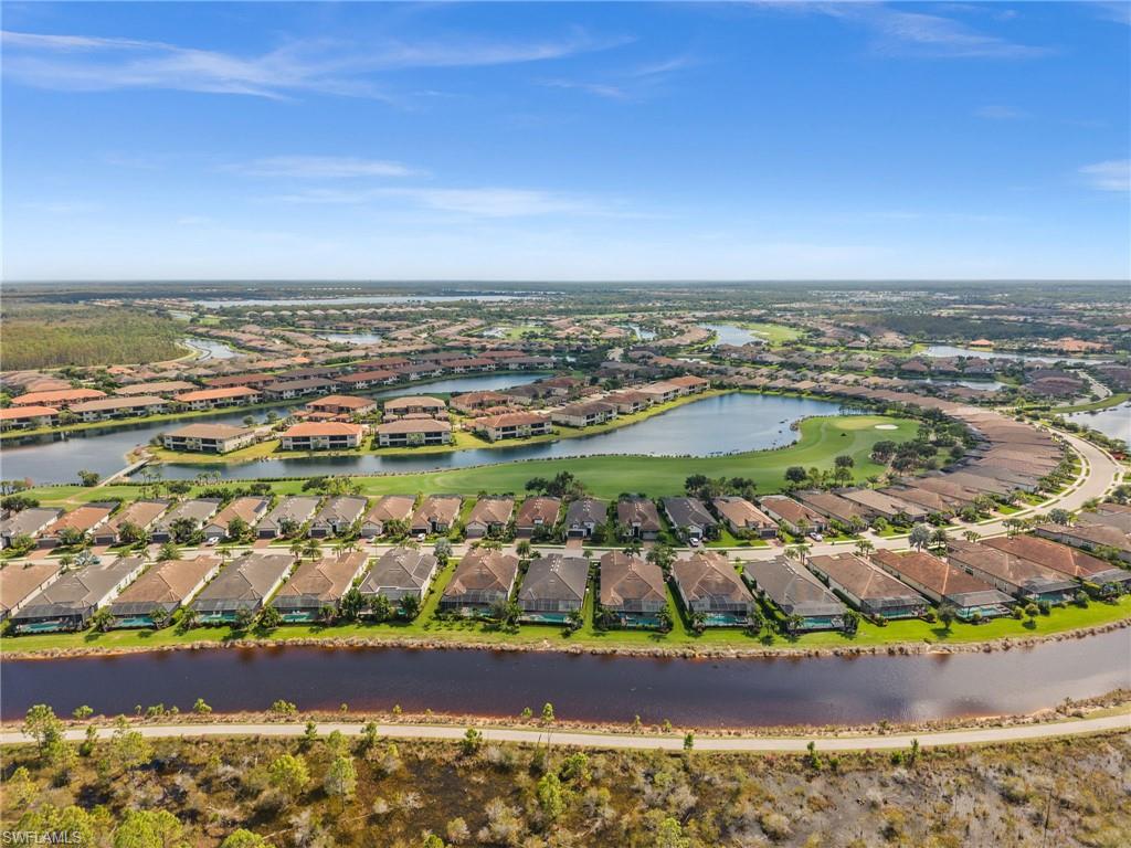 9509 Montelanico Loop Naples, FL 34119 - Photo 11 of 50 a view of a city with an ocean view