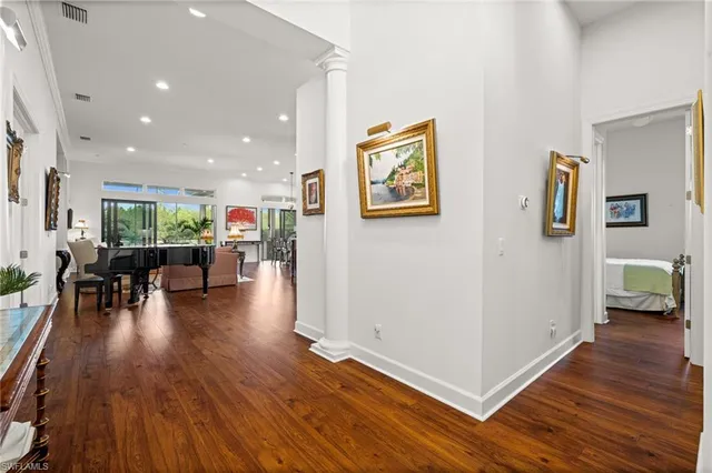 a view of a livingroom with furniture and hardwood floor