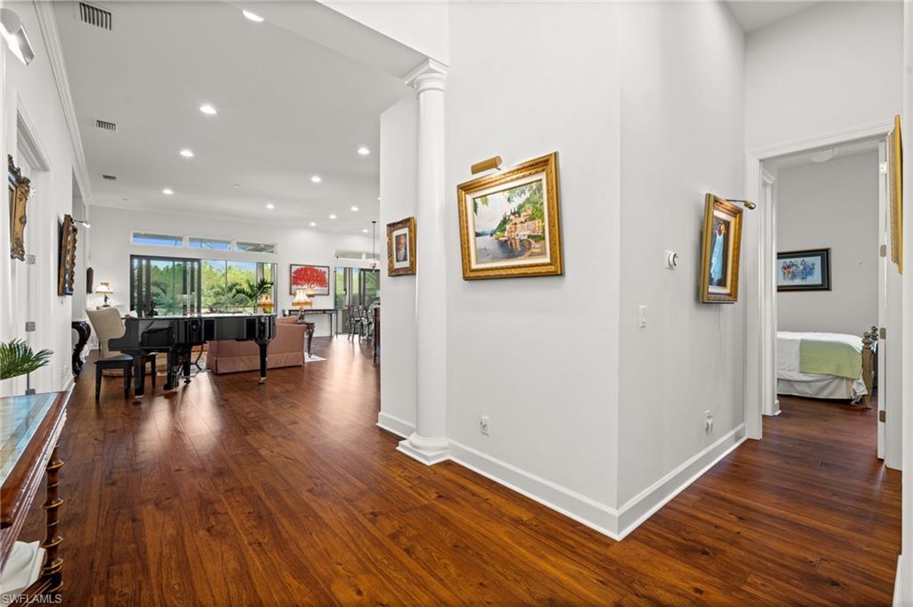 9509 Montelanico Loop Naples, FL 34119 - Photo 18 of 50 a view of a livingroom with furniture and hardwood floor