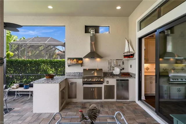a kitchen with stainless steel appliances granite countertop a stove and a refrigerator