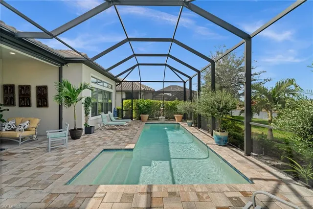 a view of a backyard with sitting area