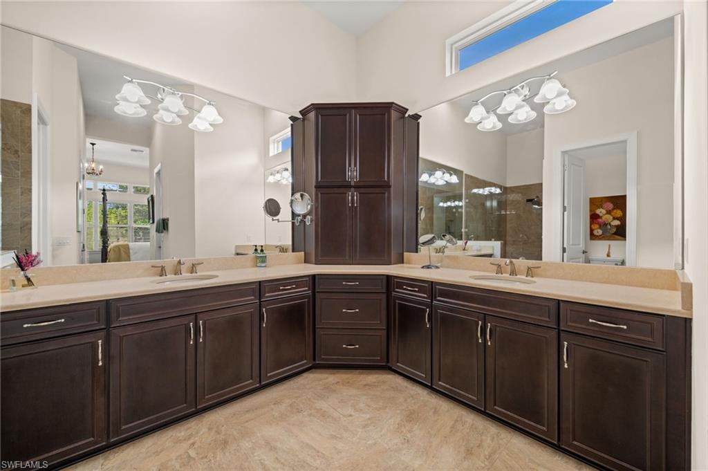 9509 Montelanico Loop Naples, FL 34119 - Photo 36 of 50 a spacious bathroom with a double vanity sink mirror and double