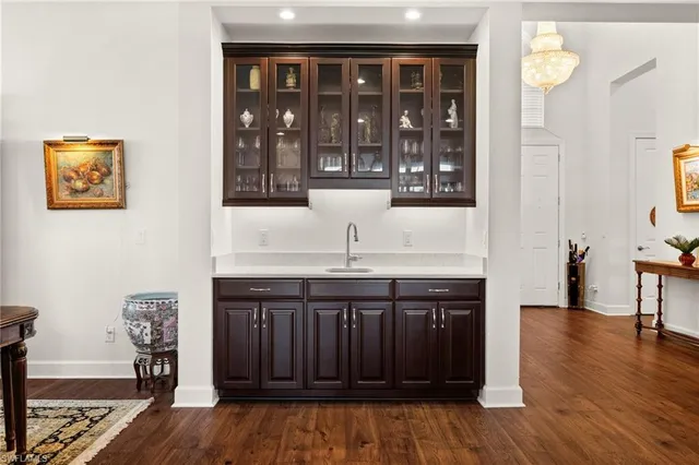 a kitchen with stainless steel appliances granite countertop a stove and a wooden cabinets