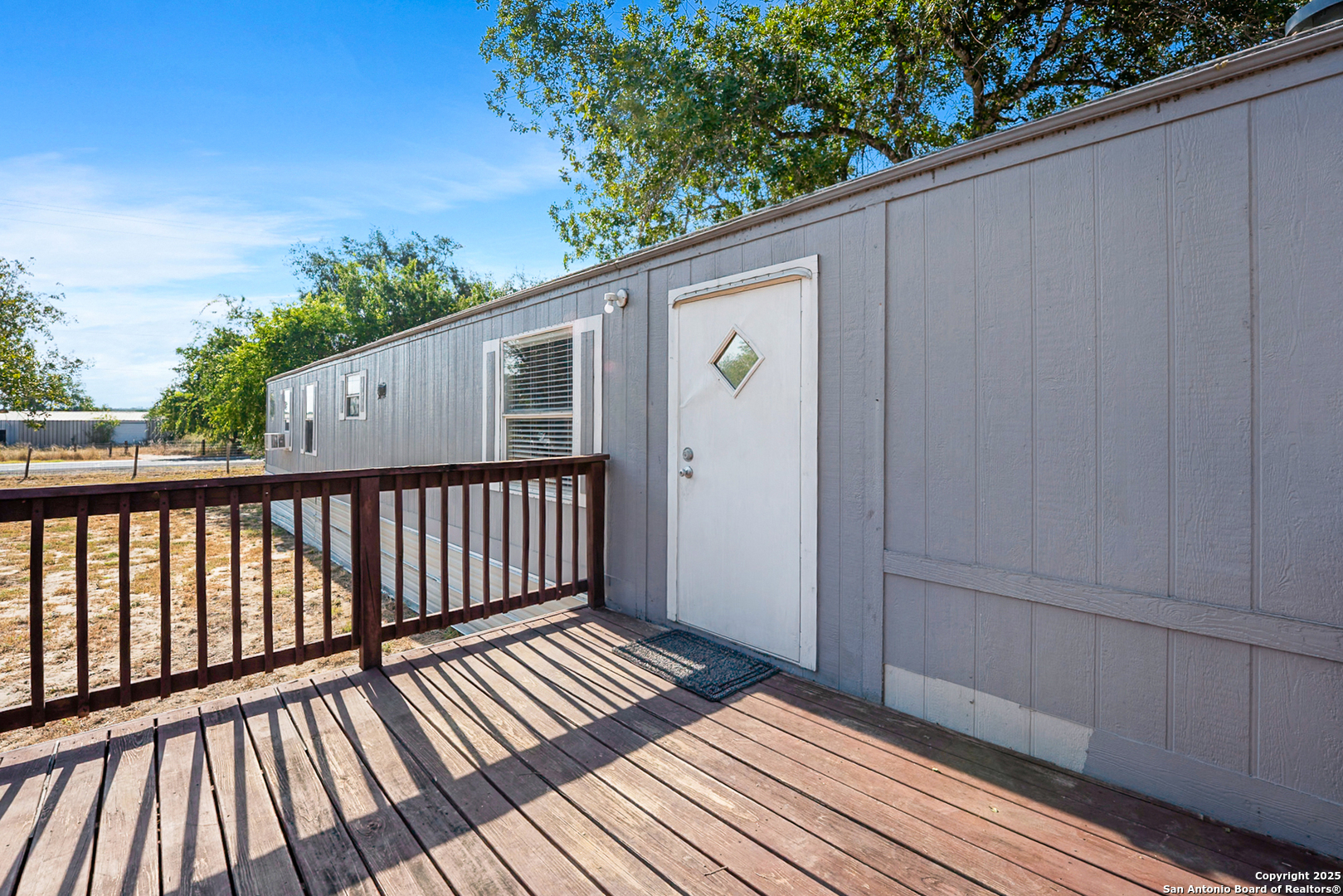 25335 Pleasanton Road San Antonio, TX 78264 - Photo 13 of 26 a view of backyard with wooden floor and fence
