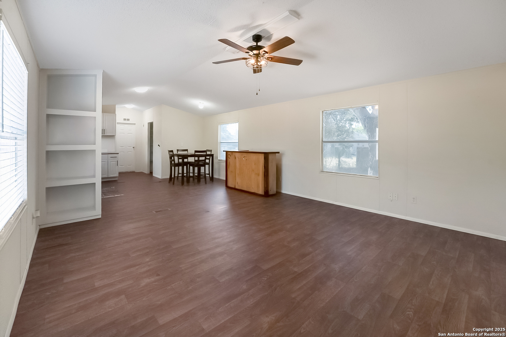25335 Pleasanton Road San Antonio, TX 78264 - Photo 14 of 26 wooden floor in an empty room with a window