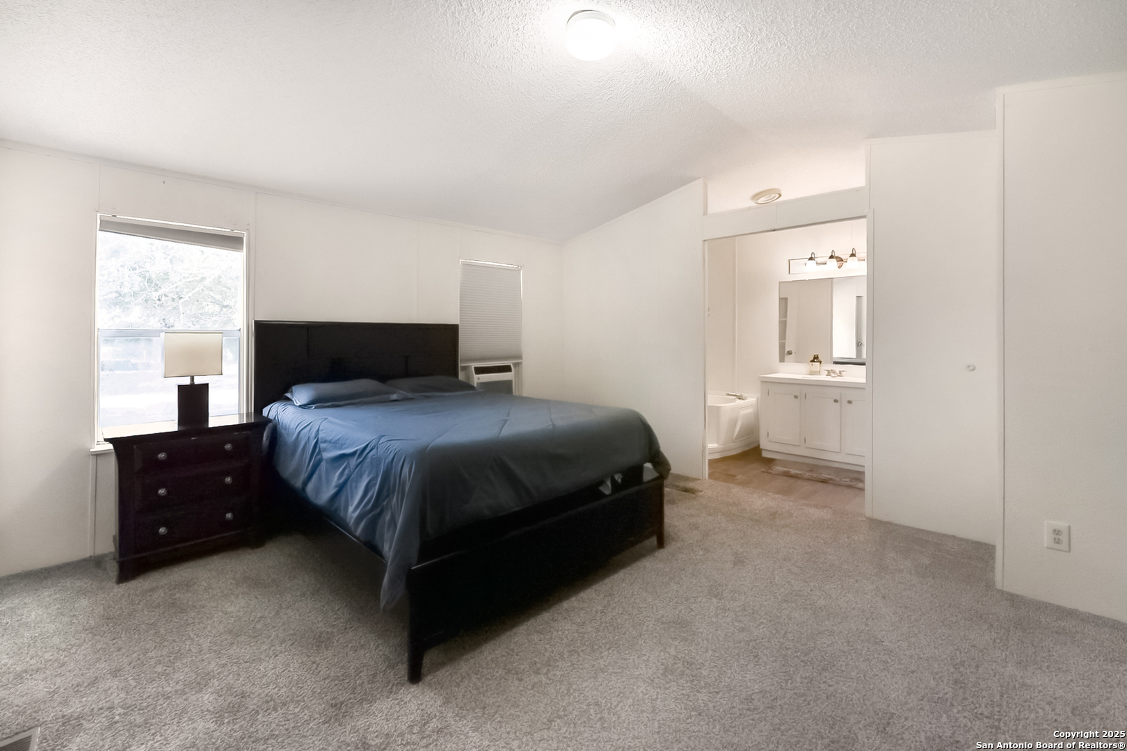 25335 Pleasanton Road San Antonio, TX 78264 - Photo 20 of 26 a bedroom with a bed and window
