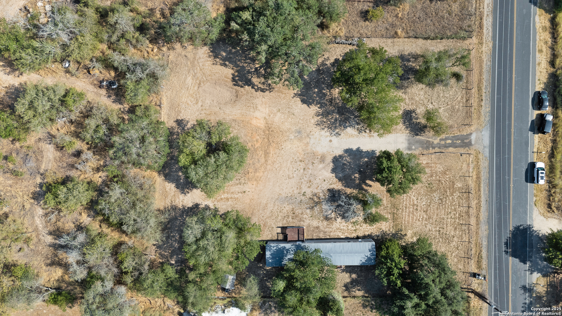 25335 Pleasanton Road San Antonio, TX 78264 - Photo 3 of 26 an aerial view of a house with yard