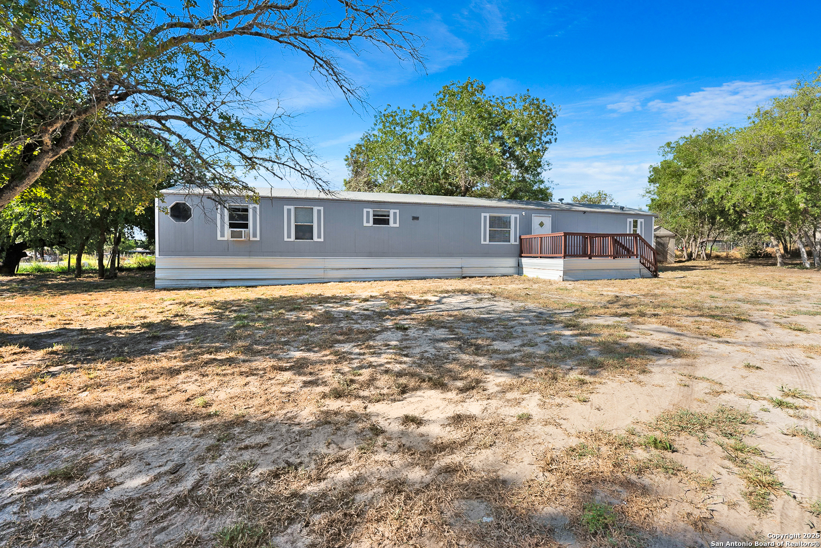 25335 Pleasanton Road San Antonio, TX 78264 - Photo 9 of 26 a house view with a garden space