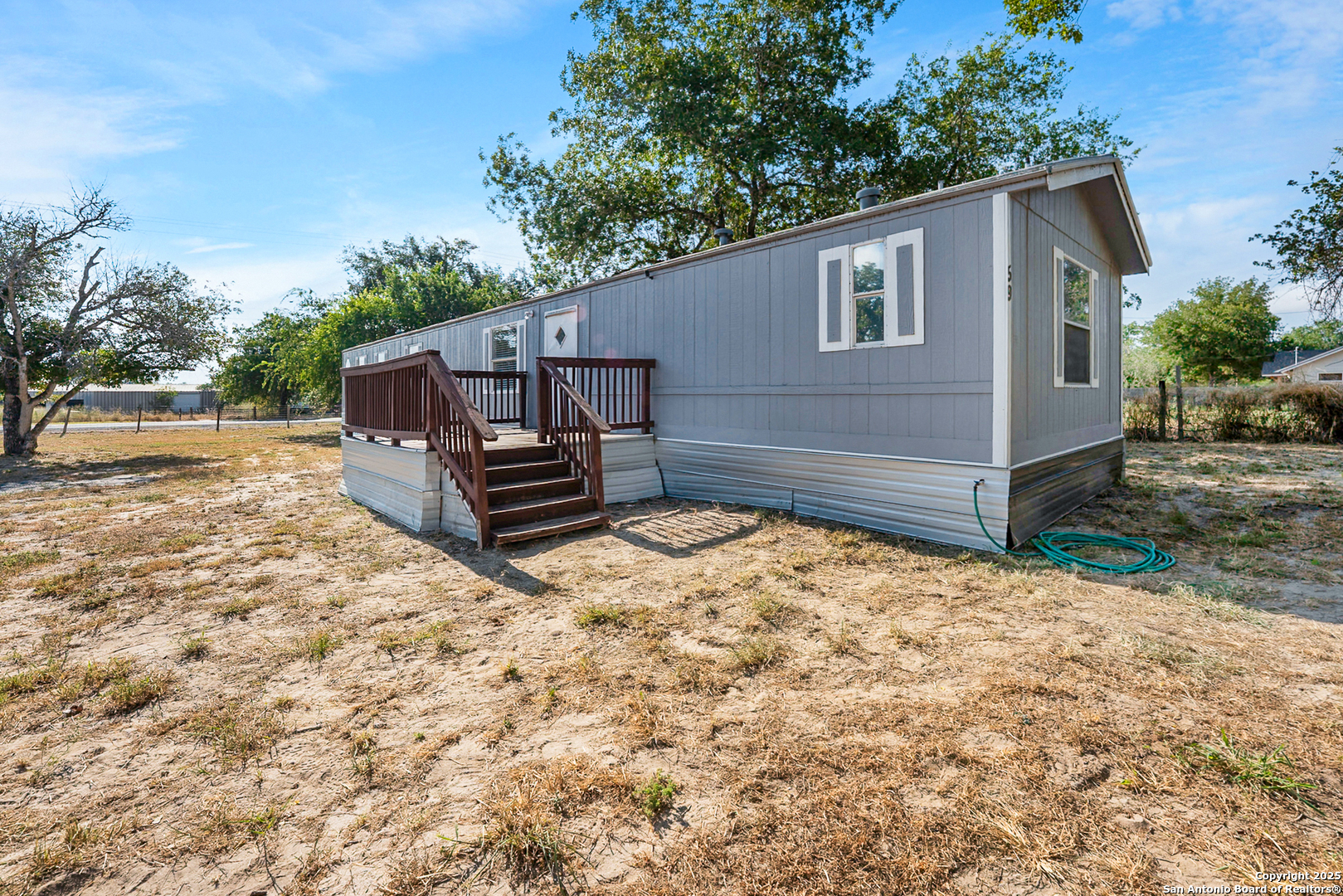 25335 Pleasanton Road San Antonio, TX 78264 - Photo 10 of 26 a view of a house with a yard