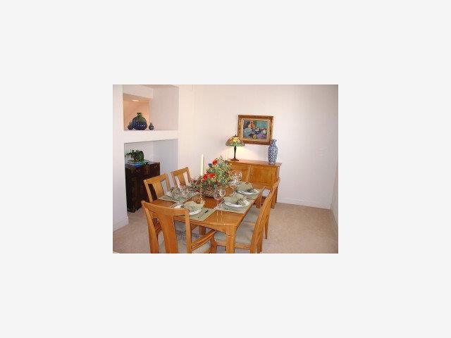 171 Rainbow Place Milpitas, CA 95035 - Photo 4 of 9 a living room with furniture and a table