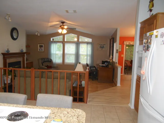 a living room with furniture a window and a chandelier