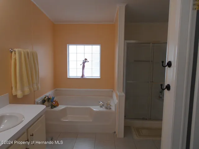 a bath room with a bath tub and a sink