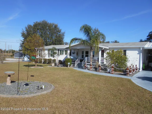 a view of a house with swimming pool