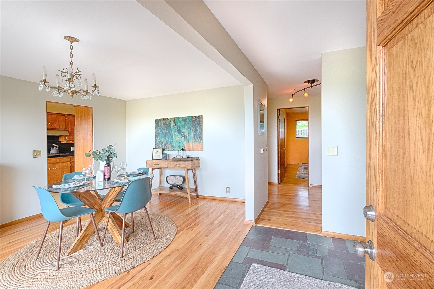 205 Powell Avenue Southwest Renton, WA 98057 - Photo 7 of 40 a view of a dining room with furniture and wooden floor