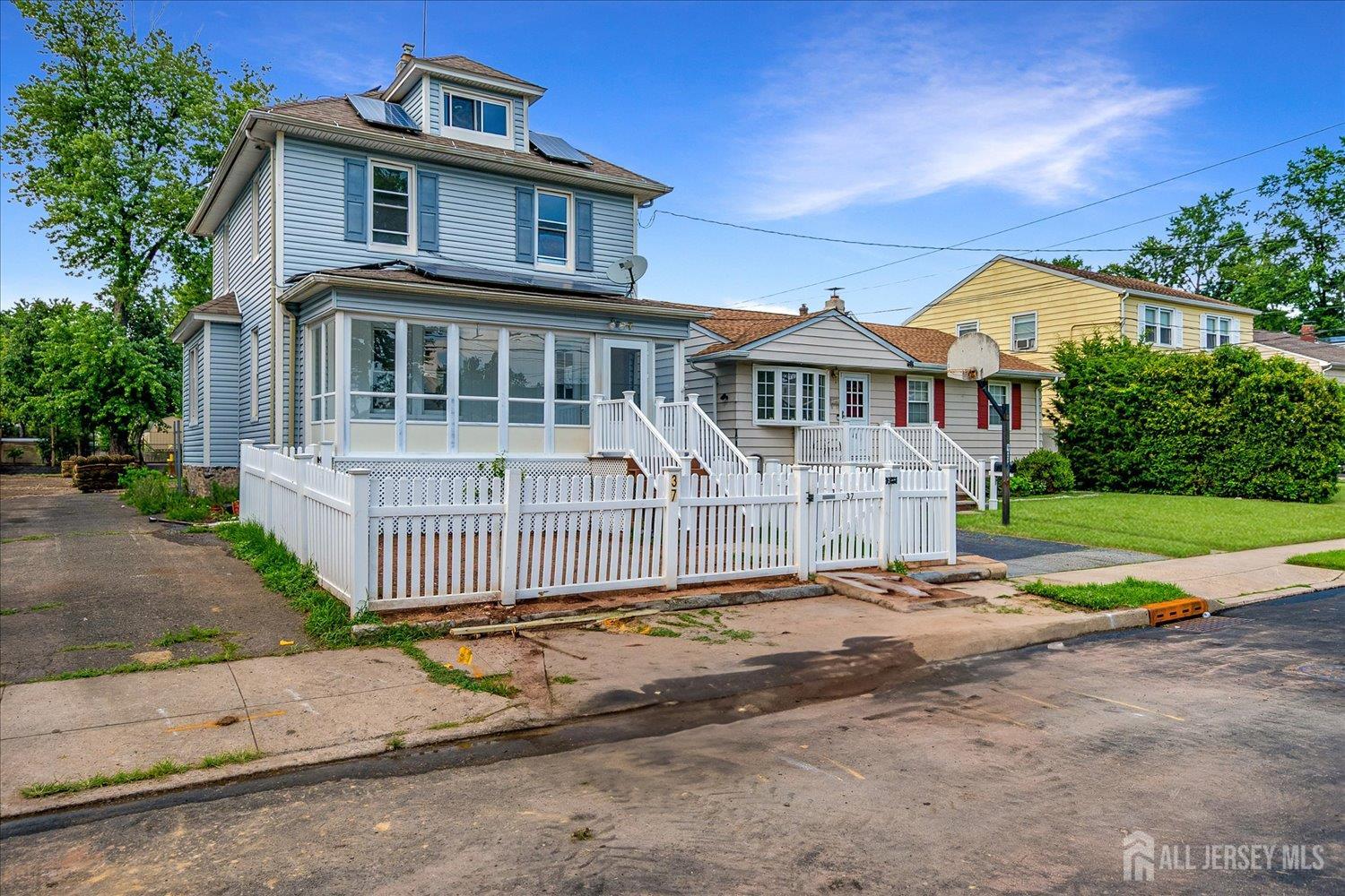 37 Summit Avenue Fords, NJ 08863 - Photo 2 of 28 a front view of a house with a garden