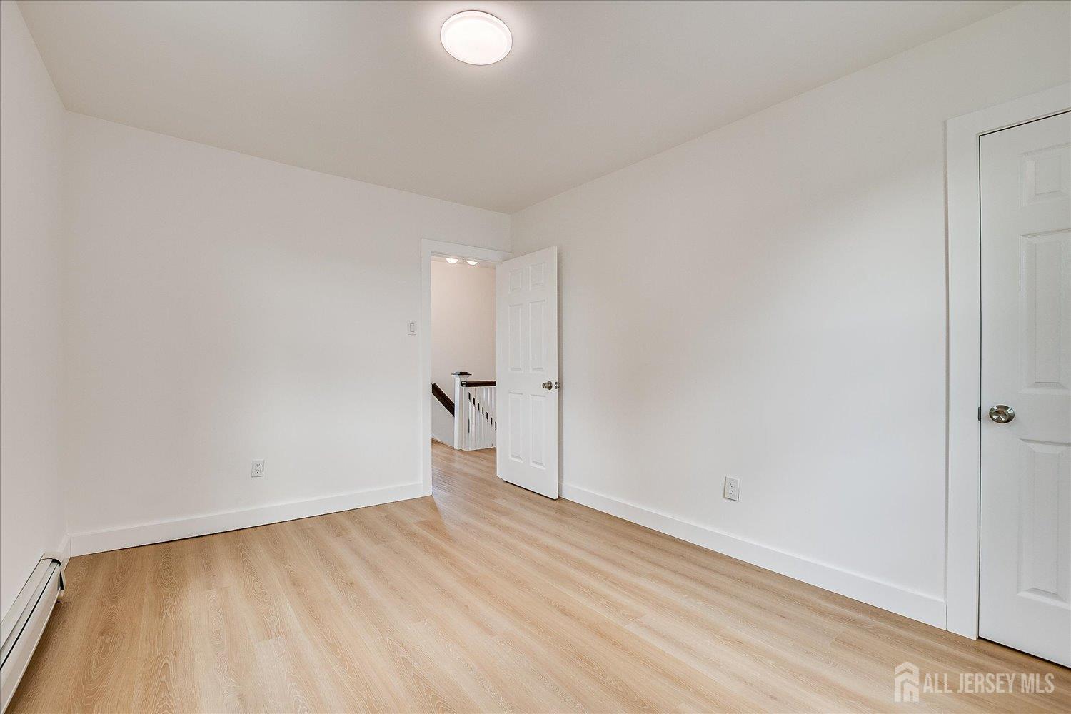 37 Summit Avenue Fords, NJ 08863 - Photo 21 of 28 a view of empty room with wooden floor
