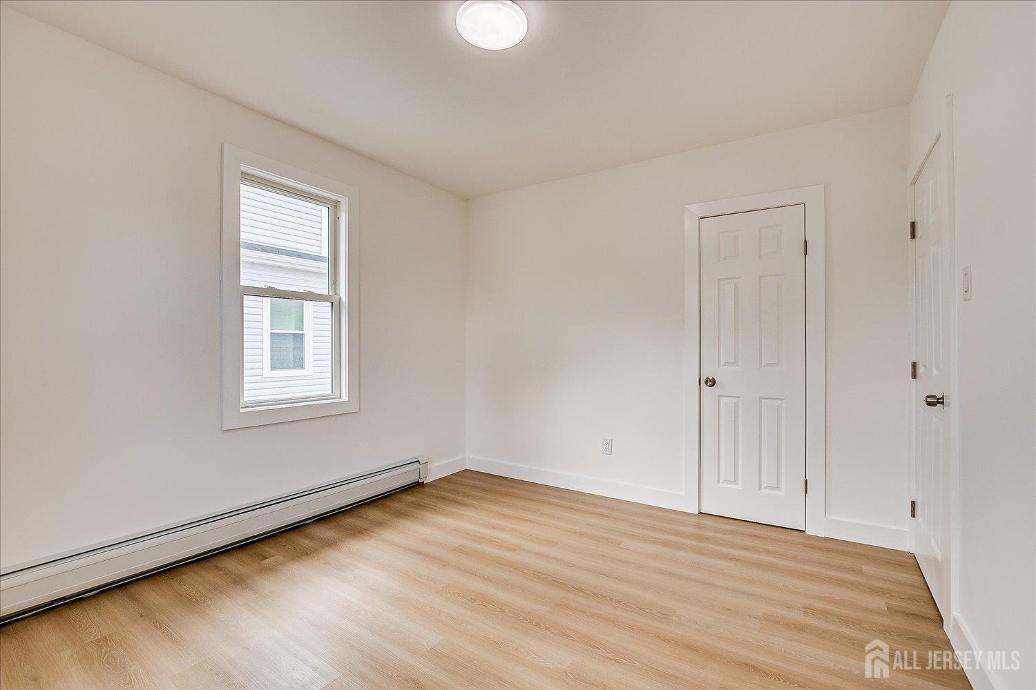 37 Summit Avenue Fords, NJ 08863 - Photo 23 of 28 a view of a room with wooden floor and windows
