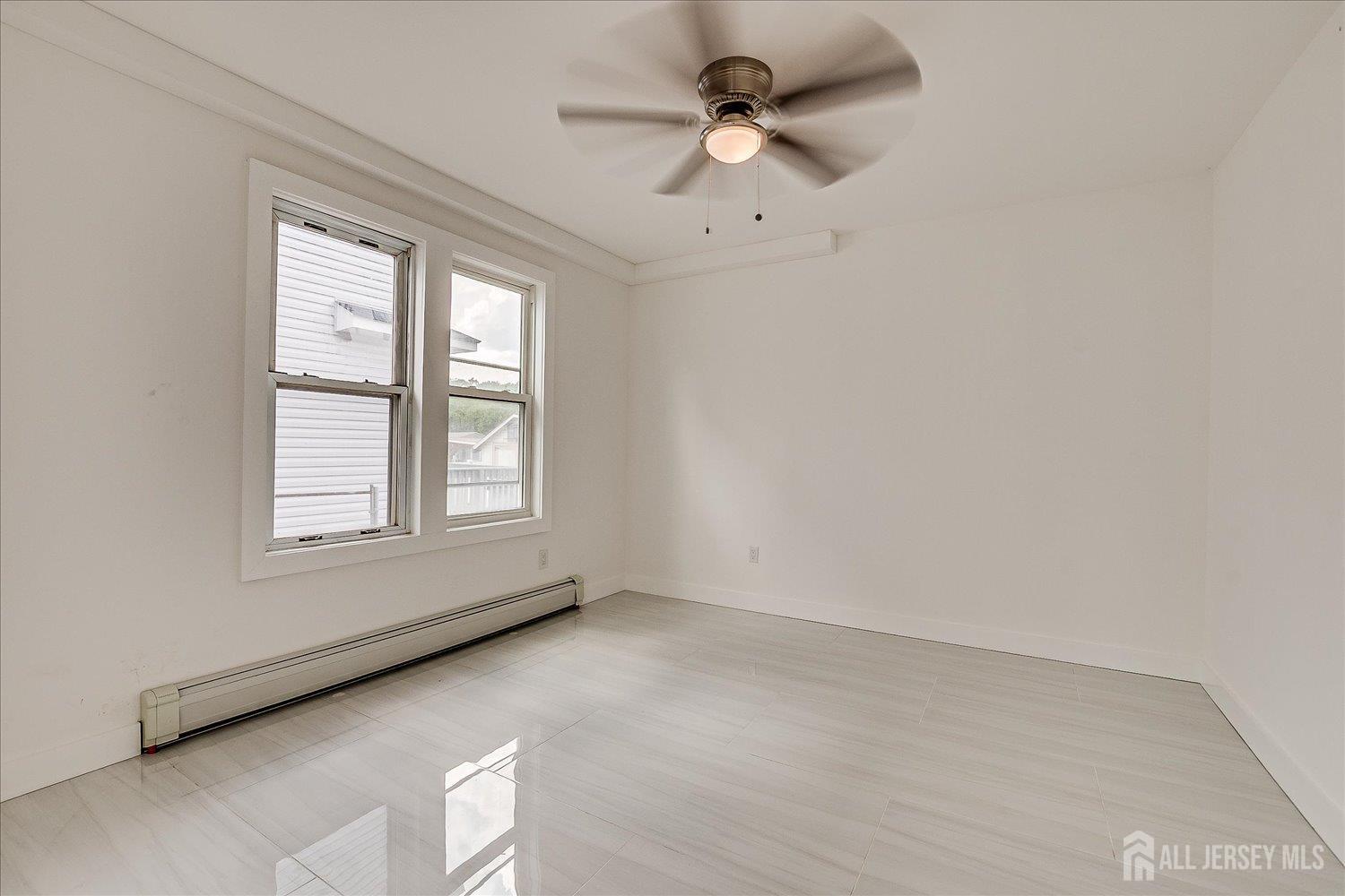37 Summit Avenue Fords, NJ 08863 - Photo 10 of 28 a view of an empty room with a window