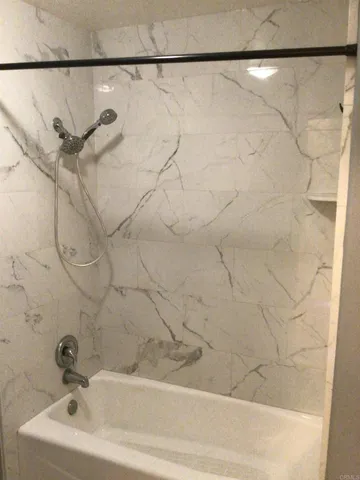 a bathroom with a sink and a shower