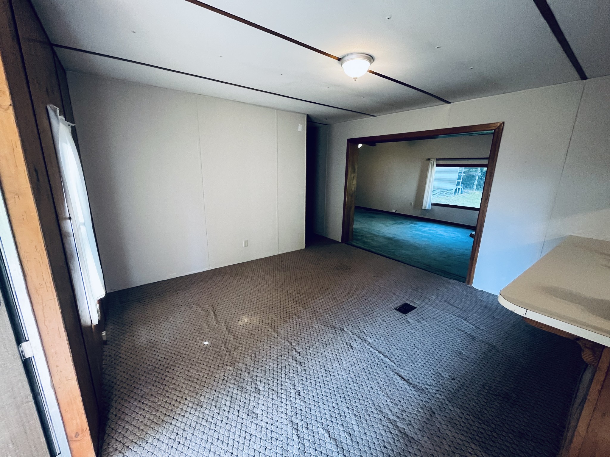 294 Ridgeway Drive Sugar Tree, TN 38380 - Photo 19 of 28 a view of an empty room and wooden floor