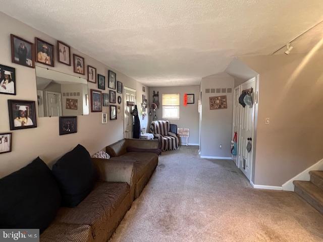 69 Scott Run Circle Bear, DE 19701 - Photo 12 of 21 a living room with furniture and a bookshelf