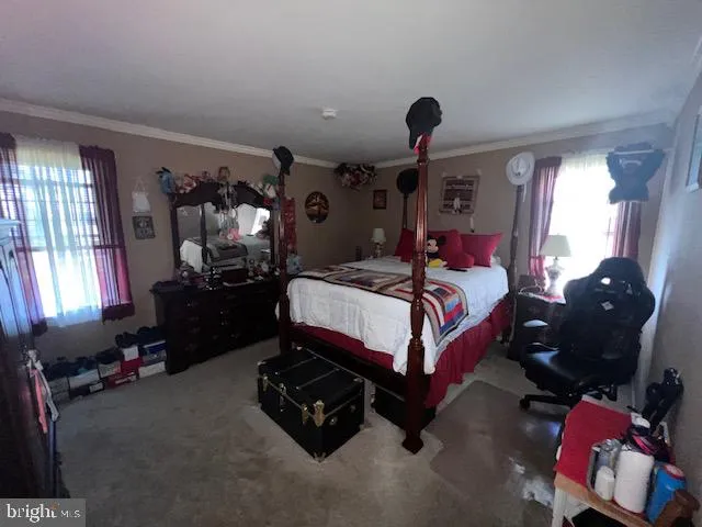 a bedroom with bed and window