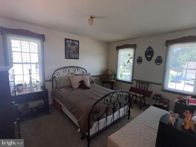 69 Scott Run Circle Bear, DE 19701 - Photo 18 of 21 a bedroom with a bed couch and window