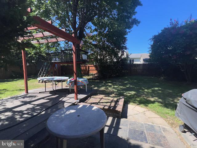 69 Scott Run Circle Bear, DE 19701 - Photo 21 of 21 a view of a patio with a table chairs and a backyard