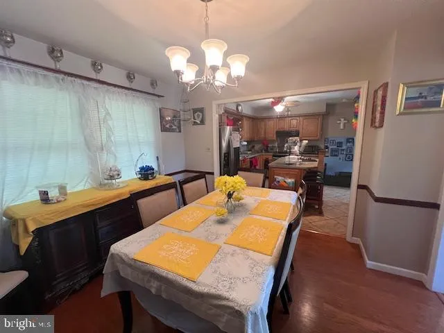 a large kitchen with a table and chairs