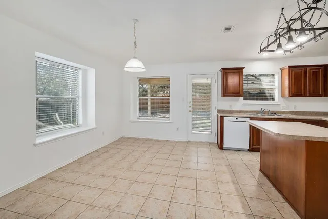 a view of kitchen with sink microwave and refrigerator