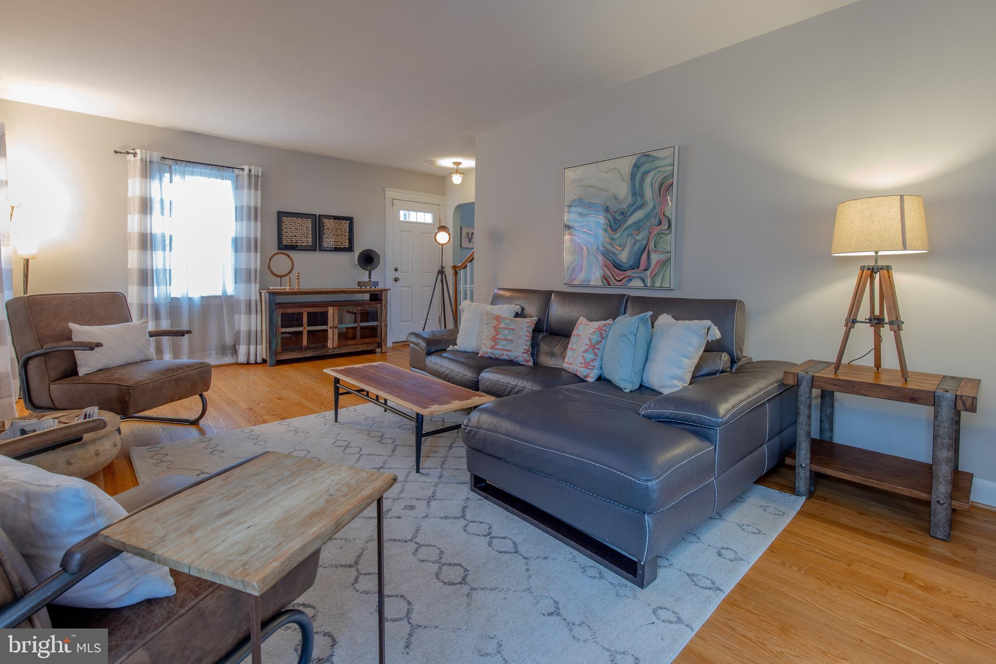 9416 Colesville Road Silver Spring, MD 20901 - Photo 1 of 40 a living room with furniture and a fireplace