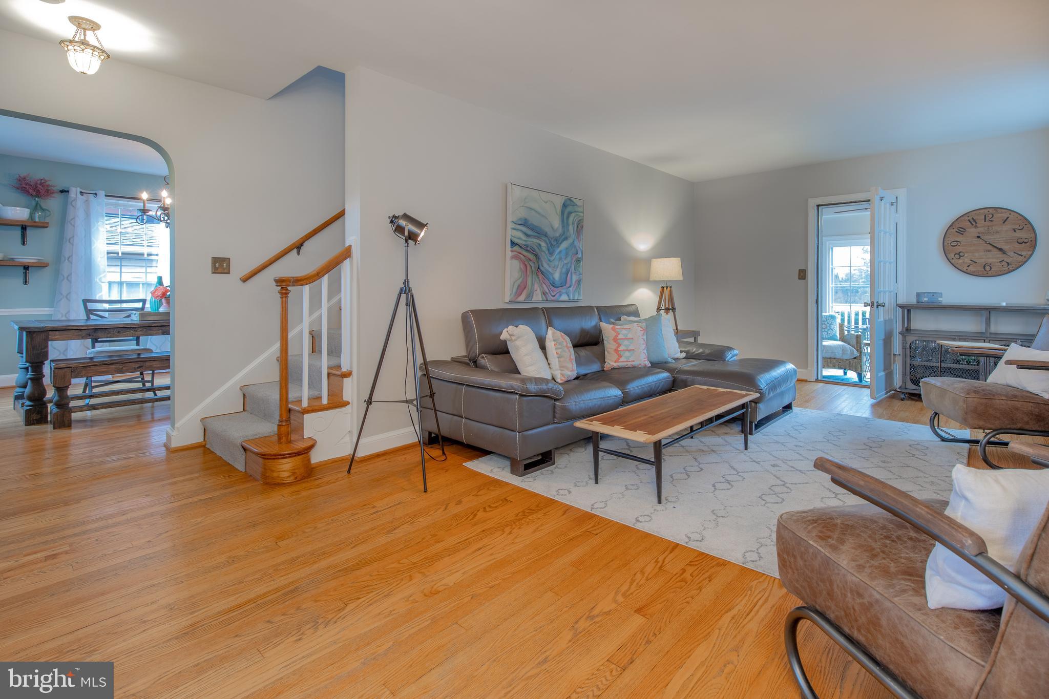 9416 Colesville Road Silver Spring, MD 20901 - Photo 3 of 40 a living room with furniture a rug and a fireplace