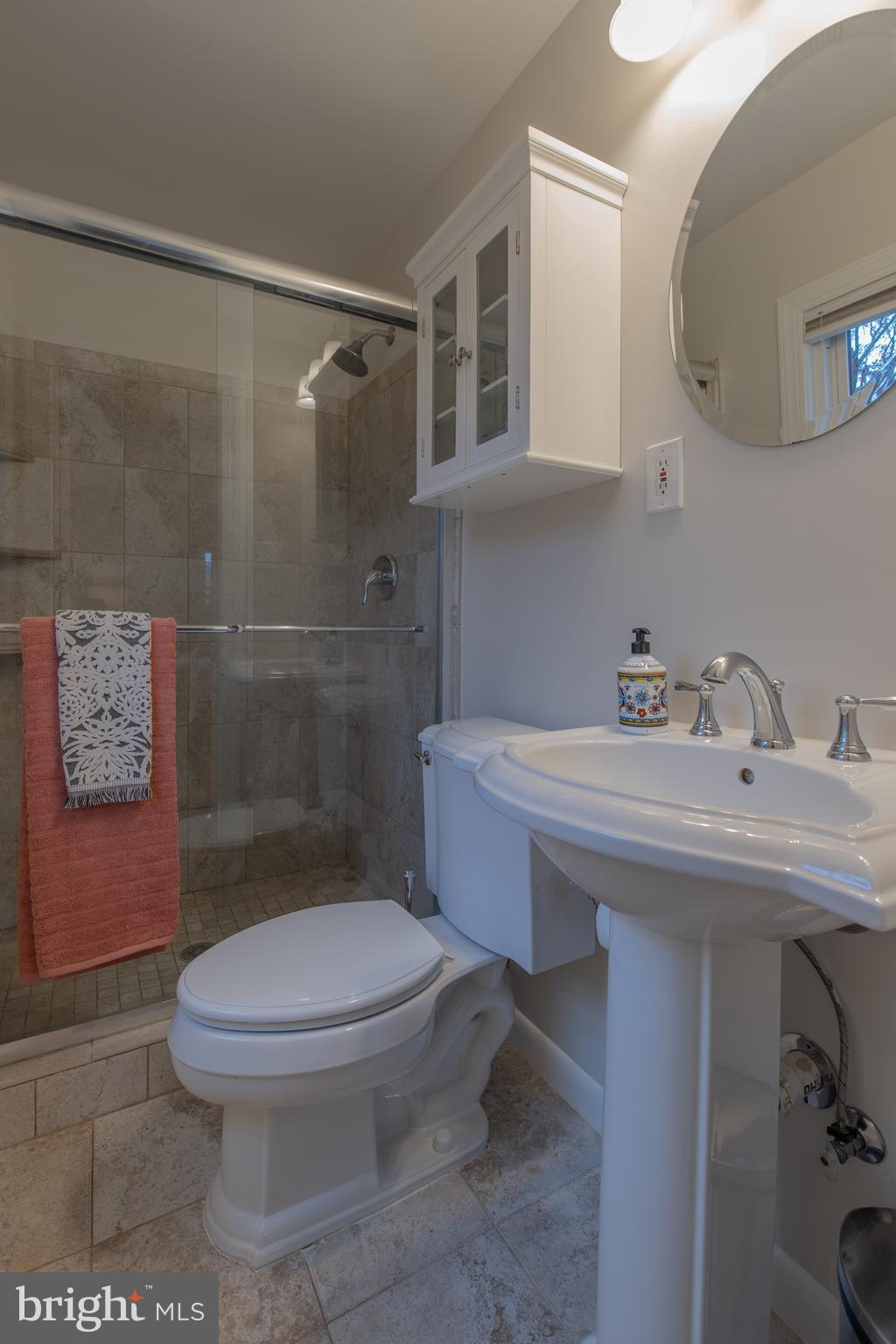 9416 Colesville Road Silver Spring, MD 20901 - Photo 22 of 40 a bathroom with a sink toilet and shower