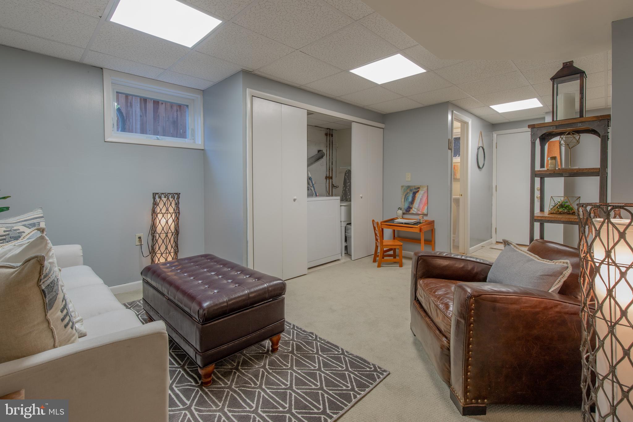 9416 Colesville Road Silver Spring, MD 20901 - Photo 31 of 40 a living room with furniture and wooden floor