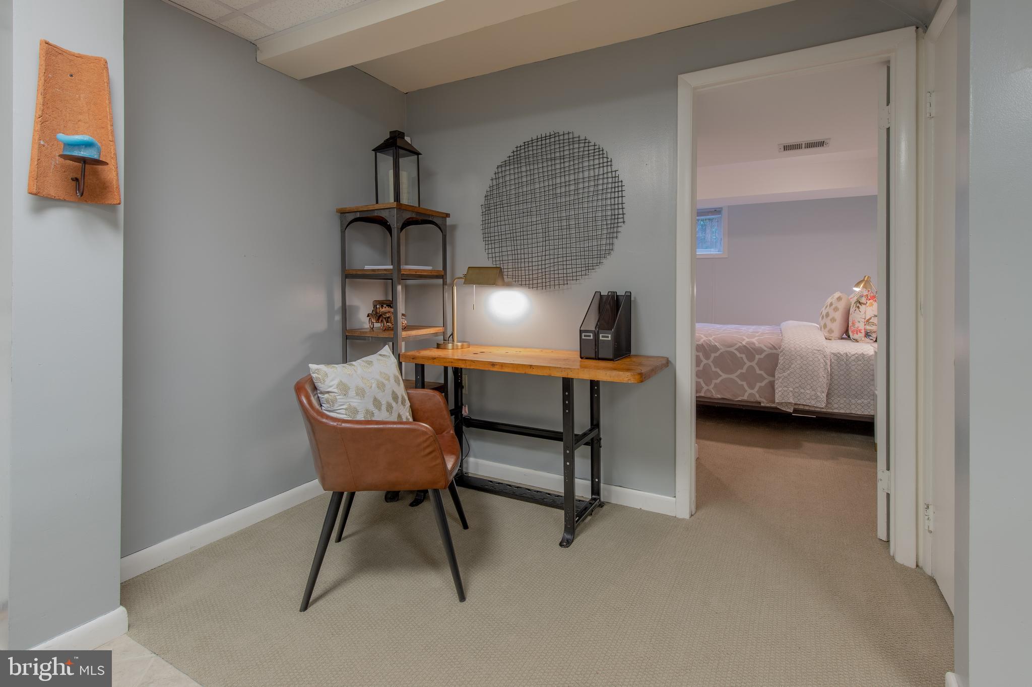 9416 Colesville Road Silver Spring, MD 20901 - Photo 33 of 40 a room with furniture and a chair