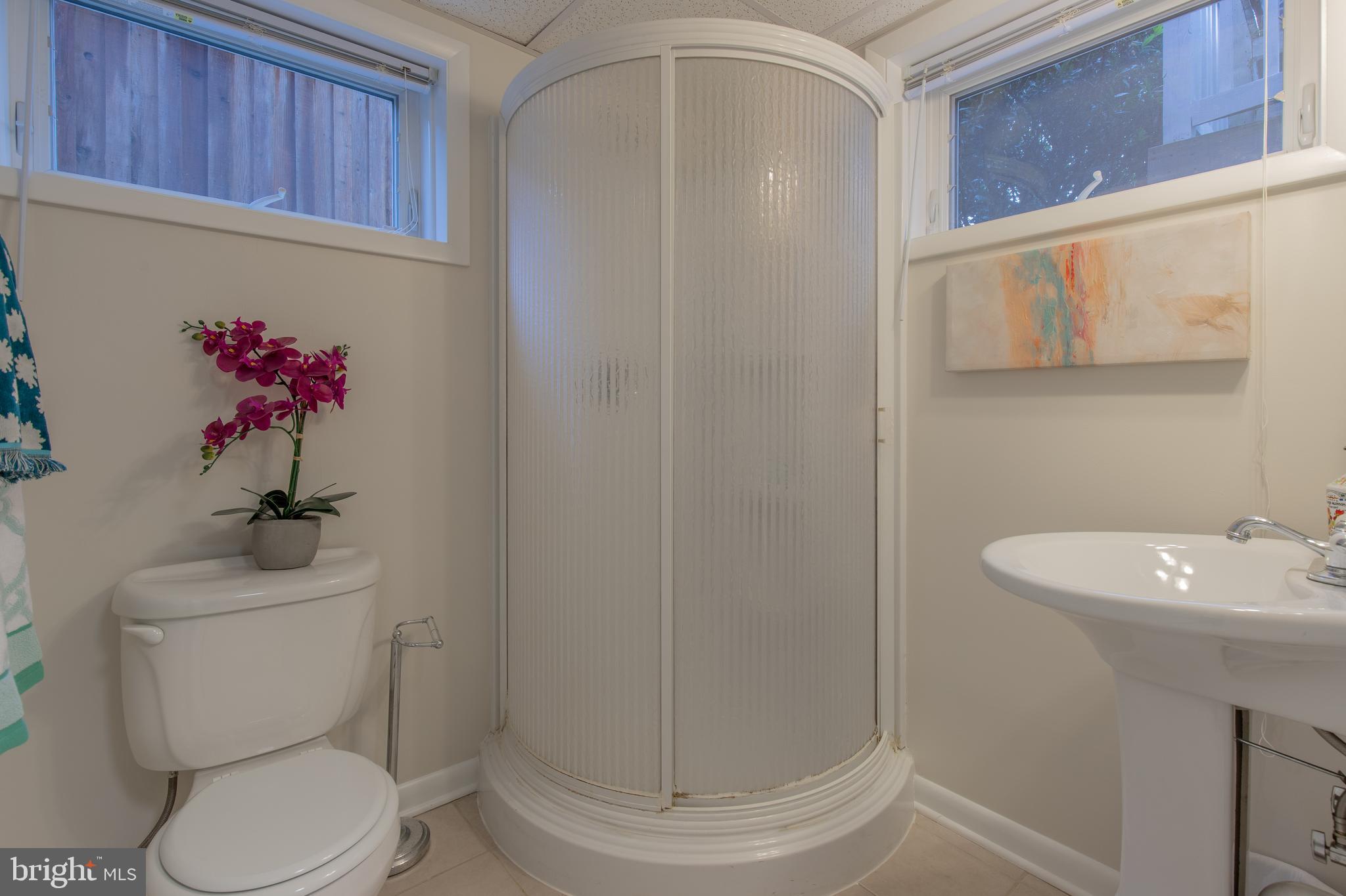 9416 Colesville Road Silver Spring, MD 20901 - Photo 40 of 40 a bathroom with a toilet sink and mirror