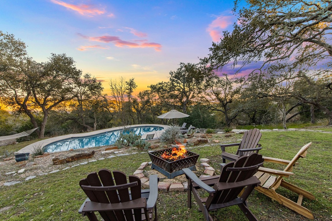 411 Whitetail Ridge Dripping Springs, TX 78620 - Photo 23 of 40 a view of a chairs and table in the patio